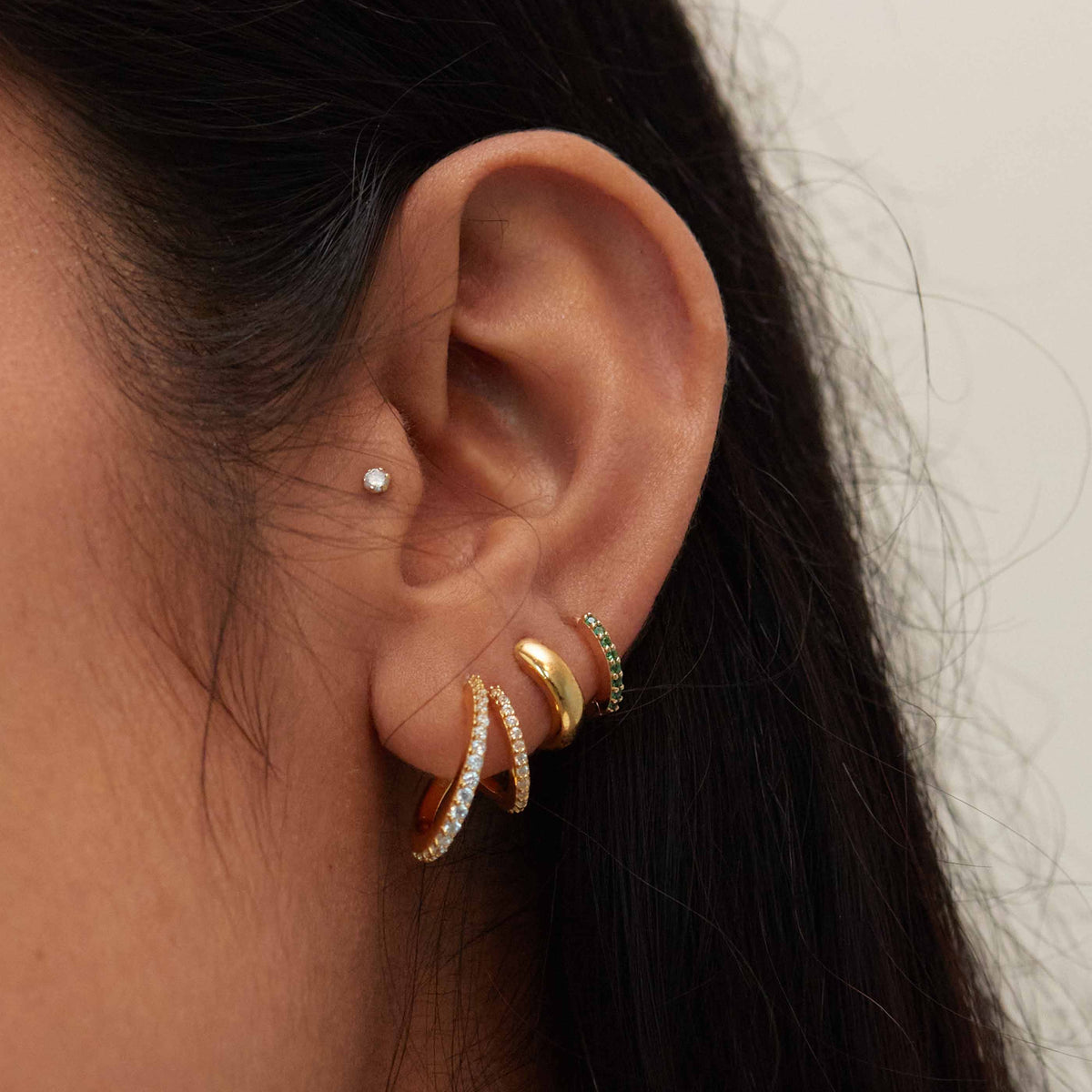May Birthstone Huggie Earrings